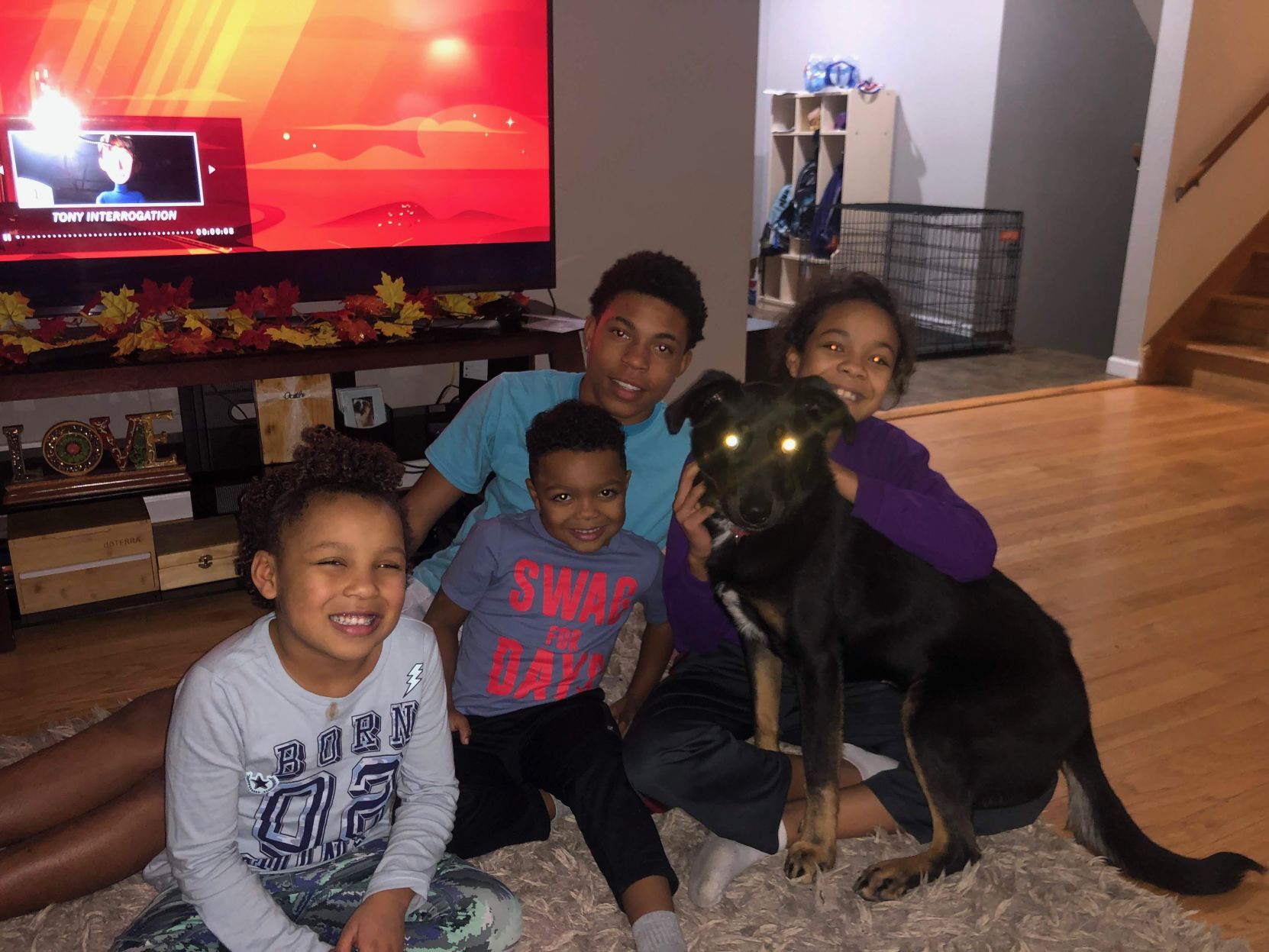 Dontrell Bush poses with his loved ones and a dog.